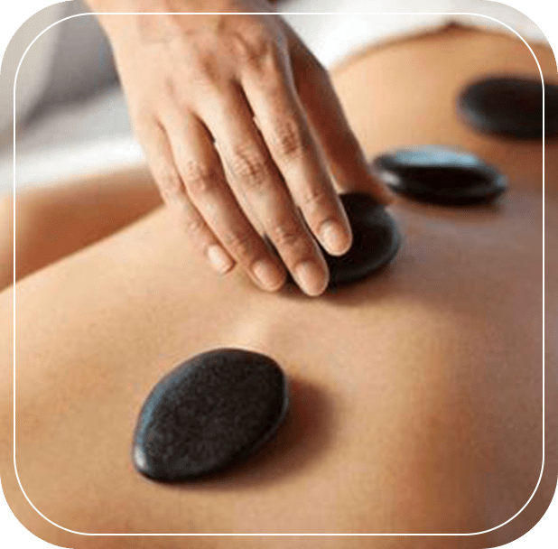 A person is getting a hot stone massage.